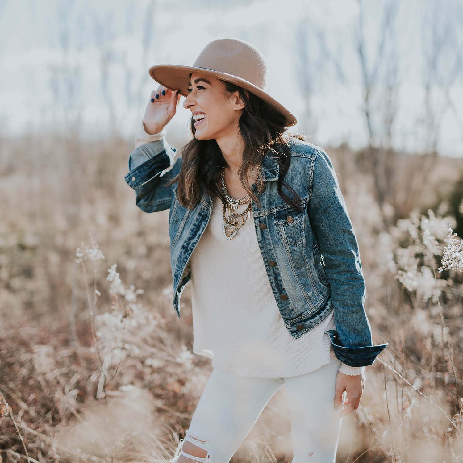 Woman in hat and jean jacket
